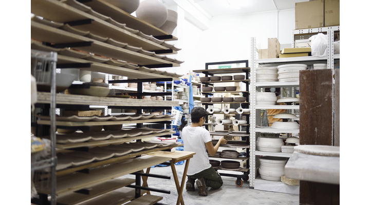 person looking through stored art