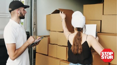 A couple stacking boxes of inventory storage