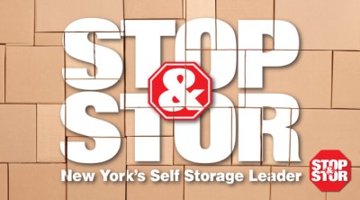 Storage boxes stacked on top of each other to display the Stop & Stor logo