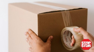 storage box being duct taped by person