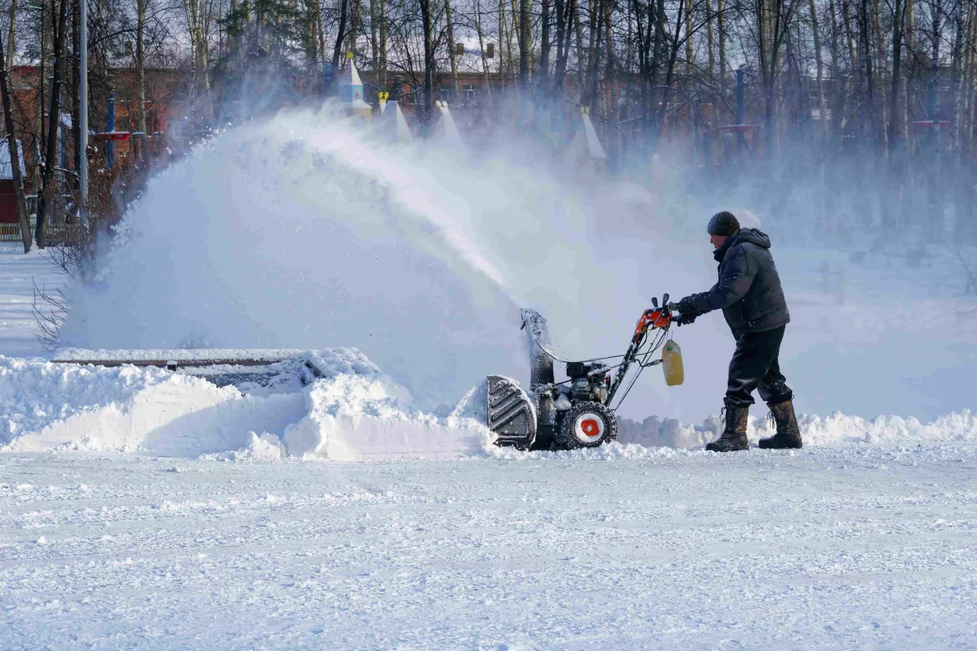 person snow blowing