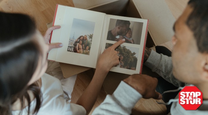 Father and daughter staring at photo album