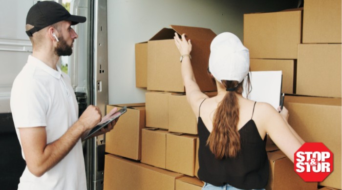 A couple stacking boxes of inventory storage